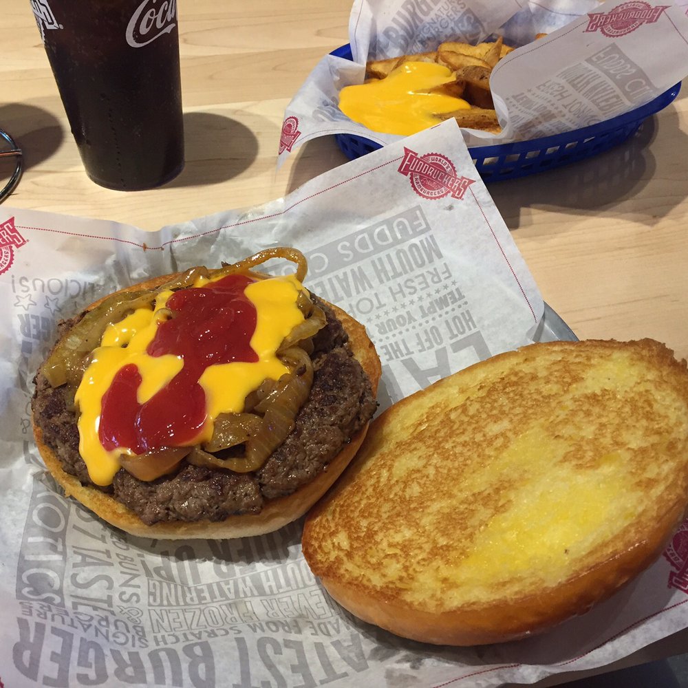 Fuddruckers - A full pound of beef, grilled onions and cheese sauce on a toasted bun....heaven. - American Near Me - Regina, Saskatchewan