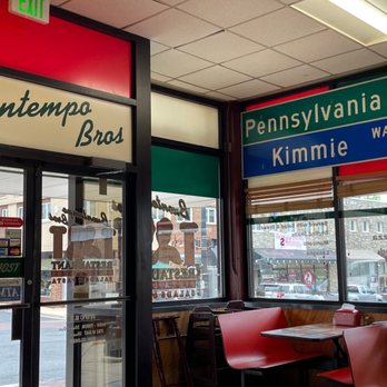 Buontempo Bros Pizza - a woman sitting at a table - Pizza Near Me - Bel Air, Maryland Buontempo Bros Pizza - a woman sitting at a table - Pizza Near Me - Bel Air, Maryland