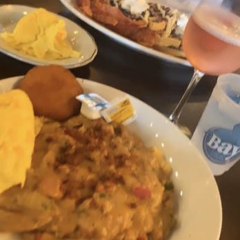 Bay Local Eatery - Brunch grits with scrambled eggs and fried biscuit. Strawberry sherbet mimosa - Breakfast & Brunch Near Me - Virginia Beach, Virginia Bay Local Eatery - Brunch grits with scrambled eggs and fried biscuit. Strawberry sherbet mimosa - Breakfast & Brunch Near Me - Virginia Beach, Virginia