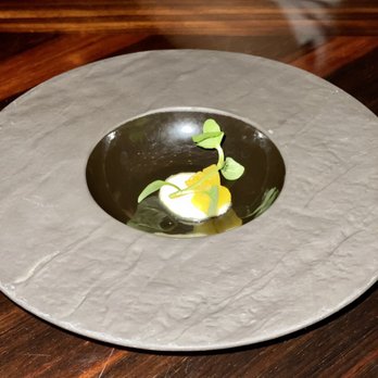 1919 Restaurant - Pre-dessert: a couple of pineapple pieces in a cream with a mint leaf - New American Near Me - San Juan, Puerto Rico 1919 Restaurant - Pre-dessert: a couple of pineapple pieces in a cream with a mint leaf - New American Near Me - San Juan, Puerto Rico
