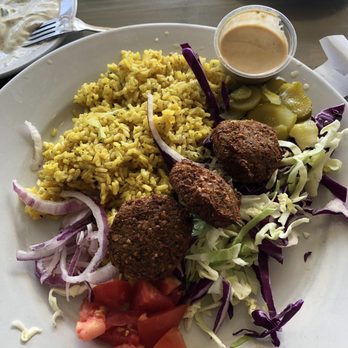 Pita Jungle - Falafel salad, brown tumeric rice and super greens (which I already ate). - Vegetarian Near Me - Glendale, Arizona Pita Jungle - Falafel salad, brown tumeric rice and super greens (which I already ate). - Vegetarian Near Me - Glendale, Arizona