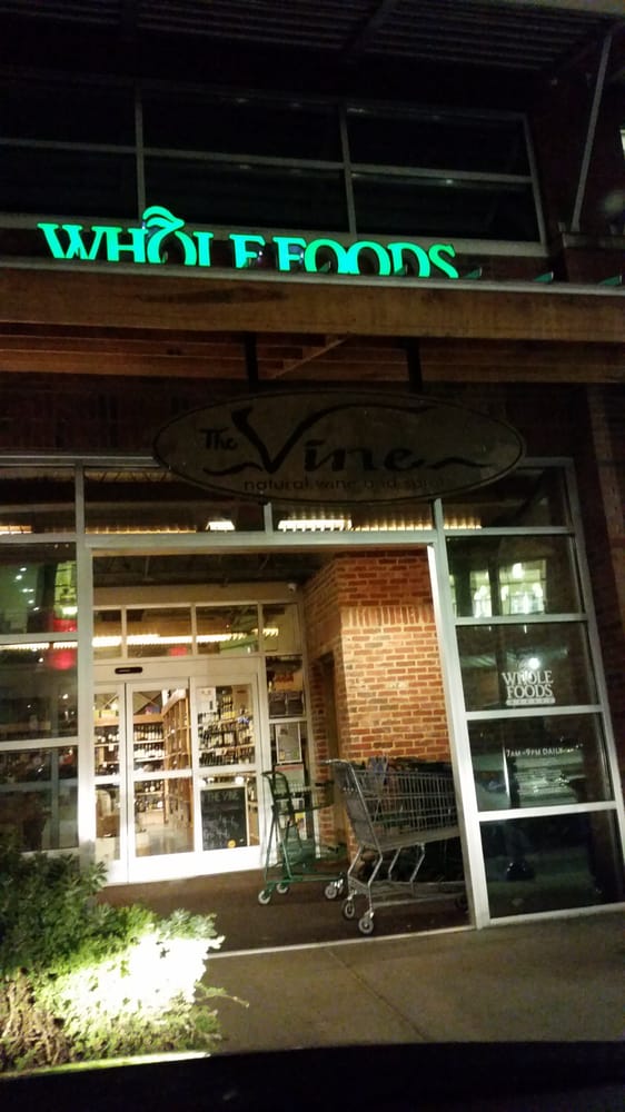 The Vine Wine And Spirits Logo