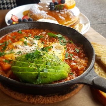 Café Portrait - Shakshuka and pancakes in the background. - Cafes Near Me - Vancouver, British Columbia Café Portrait - Shakshuka and pancakes in the background. - Cafes Near Me - Vancouver, British Columbia
