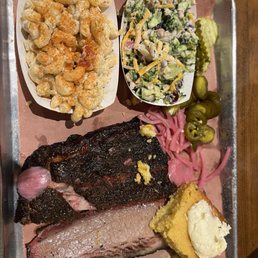 Two meat plate with ribs, brisket, Mac and cheese, and broccoli salad