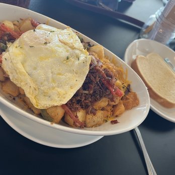 Brick and Spoon - Texas City - Loaded Hash, egg over medium & sourdough toast - Breakfast & Brunch Near Me - Texas City, Texas Brick and Spoon - Texas City - Loaded Hash, egg over medium & sourdough toast - Breakfast & Brunch Near Me - Texas City, Texas