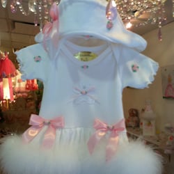 Best seller!All cotton onesie dress trimmed with fur, sizes 0-3,6,12,18,24 months $135.00 matching picture hat 55.00 Free personalizing!