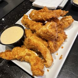 Stadium Sports Bar and Grill - Crispy chicken tenders w/ chipotle ranch sauce... And that sauce has a nice kick.