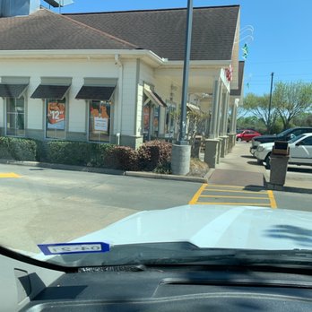 Popeyes Louisiana Kitchen - a view of the outside of a restaurant - Fast Food Near Me - Tomball, Texas
