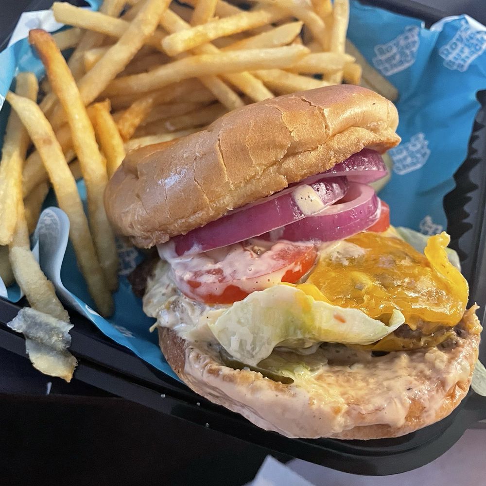 Roys cheeseburger with fries Roys cheeseburger with fries