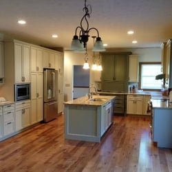 Jenkins Contracting - This kitchen remodel has too many features to list, but the two-tone cabinet design, hickory flooring and quartz counter tops...