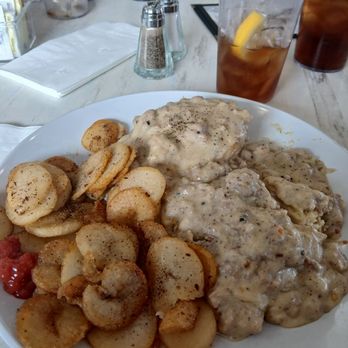 At Long Last - Biscuits with sausage gravy and home fries. Look at that sausage! - Breakfast & Brunch Near Me - Auburn, New York