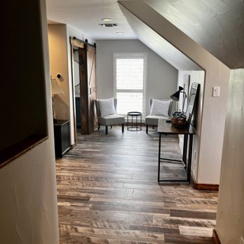 Flippin Floors Plus - a view of a living room from the stairs - Flooring Near Me - Granbury, Texas Flippin Floors Plus - a view of a living room from the stairs - Flooring Near Me - Granbury, Texas