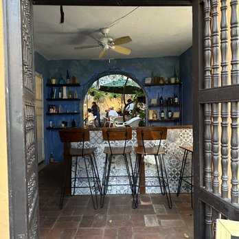 El Champi - Outside front door looking in to back courtyard - Tapas/Small Plates Near Me - San Juan, Puerto Rico El Champi - Outside front door looking in to back courtyard - Tapas/Small Plates Near Me - San Juan, Puerto Rico