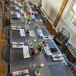 a long table set for a wine tasting