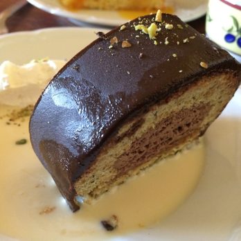 Iberia Restaurant - Pistachio and chocolate cake, with whip cream and custard sauce. Lot lighter than it sounds ;) - Tapas/Small Plates Near Me - Belmont, California