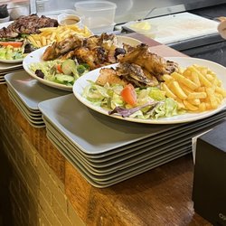 Aux Trois Gourmands - Grilled chicken and ribeye plate with salad and chips.
