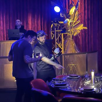 Papi Steak - social media crew (foreground); DJ (background) - Steakhouses Near Me - Las Vegas, Nevada Papi Steak - social media crew (foreground); DJ (background) - Steakhouses Near Me - Las Vegas, Nevada