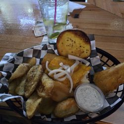 Fish sandwich, tarter sauce, potato waves