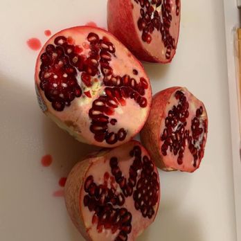 Sinbad Hookah Cafe - pomegranates on a cutting board - Cafes Near Me - Austin, Texas Sinbad Hookah Cafe - pomegranates on a cutting board - Cafes Near Me - Austin, Texas