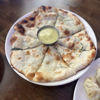 Masala Waves - spinach dip naan: naan bread stuffed with spinach dip + indian cheese = $9.00 - Indian Near Me - Huntington Beach, California Masala Waves - spinach dip naan: naan bread stuffed with spinach dip + indian cheese = $9.00 - Indian Near Me - Huntington Beach, California