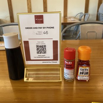 Komé - Table condiments -- that chili oil is the best! - Japanese Near Me - Austin, Texas