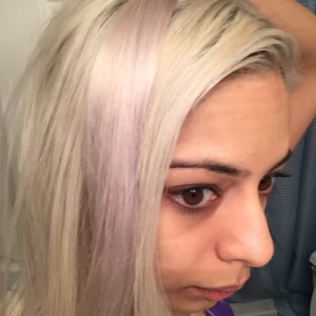 Wonderland Studios - holding up the clp-in hair extensions that was toned to match my hair - clearly it is more purple than blonde - Hair Salons Near Me - Fairfax, Virginia