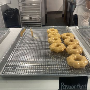 Mochido - a row of glazed donuts on a cooling rack - Desserts Near Me - Coquitlam, British Columbia Mochido - a row of glazed donuts on a cooling rack - Desserts Near Me - Coquitlam, British Columbia