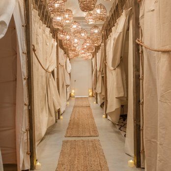 The NOW Massage Long Beach - Our Journey Room hallway: natural wood surfaces and exposed beams are coupled with sheep skins and rawhides. - Massage Near Me - Long Beach, California The NOW Massage Long Beach - Our Journey Room hallway: natural wood surfaces and exposed beams are coupled with sheep skins and rawhides. - Massage Near Me - Long Beach, California
