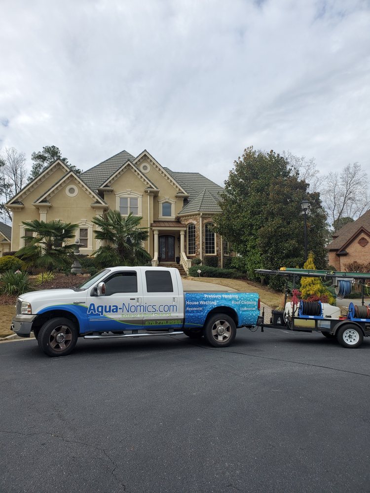 Slide of Aqua-Nomics Pressure Washing and Roof Cleaning