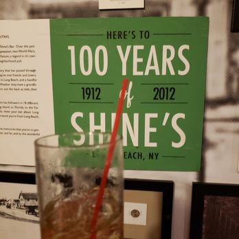 Shine's Bar - a hand holding a drink - Pubs Near Me - Long Beach, New York Shine's Bar - a hand holding a drink - Pubs Near Me - Long Beach, New York