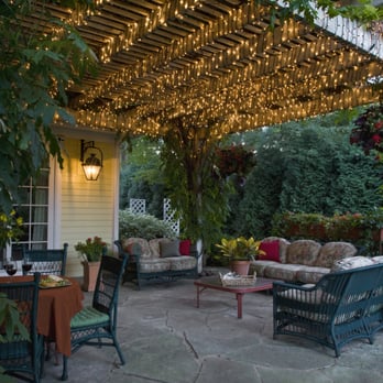 Bertrand Landscape - a patio with a table and chairs - Landscaping Near Me - Monee, Illinois Bertrand Landscape - a patio with a table and chairs - Landscaping Near Me - Monee, Illinois
