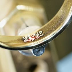 ArtGold - Close-up of the Art Gold 18K signature hallmark, marking authentic craftsmanship from Art Gold Jewelry in Everett, MA.