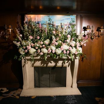 Poppy's Petalworks - Fireplace mantle floral arrangement designed by Laura, Poppy's Petalworks, to hide a very unattractive picture over the fireplace - Floral Designers Near Me - San Francisco, California Poppy's Petalworks - Fireplace mantle floral arrangement designed by Laura, Poppy's Petalworks, to hide a very unattractive picture over the fireplace - Floral Designers Near Me - San Francisco, California
