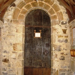 Church of St Mary Magdalene - South door (inside porch): Norman, with two orders of simple 'ripple' decoration over the arch.