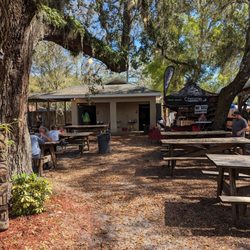 Broken Spoke Saloon - Seating area with outdoor restrooms