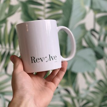 Revolve Cafe - a person holding a coffee mug - Cafes Near Me - Saskatoon, Saskatchewan Revolve Cafe - a person holding a coffee mug - Cafes Near Me - Saskatoon, Saskatchewan