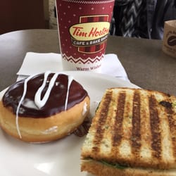 Vanilla cream-filled donut and spinach & mozzarella panini.