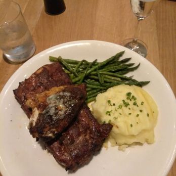 Earls Kitchen + Bar - Ribs and chicken. The ribs were so good. That little chunk on top was the chicken but was nothing special. - New American Near Me - Orlando, Florida