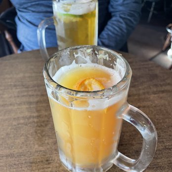 Morrison Holiday Bar - a glass of orange juice and a mug of beer - American Near Me - Morrison, Colorado