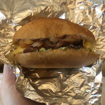 Cafe Opla - Deluxe breakfast sandwich (tomato, bacon, scrambled egg, avocado) - Coffee & Tea Near Me - Seattle, Washington
