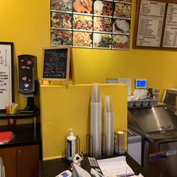 menus on a yellow wall