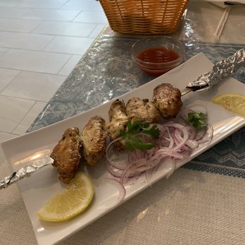 Shohsaroy Restaurant - Chicken wings kebab with side tomatoes with herbs sauce on the side - Uzbek Near Me - Brooklyn, New York