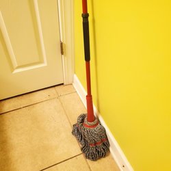 Elliott Realty Beach Rentals - Dirty floors with mop left in bathroom wet