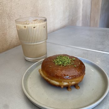 Little Flower - Iced latte with rose and vanilla; Firni donut. - Coffee & Tea Near Me - Astoria, New York Little Flower - Iced latte with rose and vanilla; Firni donut. - Coffee & Tea Near Me - Astoria, New York