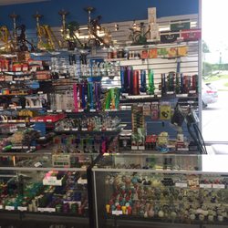 Ohmies Vape And Glass Emporium - What a wall of pipes!
