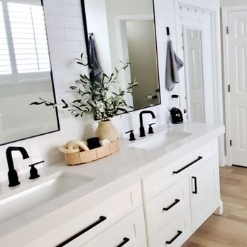 Zona Restoration - a white bathroom with two sinks and a large mirror - Damage Restoration Near Me - Tempe, Arizona Zona Restoration - a white bathroom with two sinks and a large mirror - Damage Restoration Near Me - Tempe, Arizona