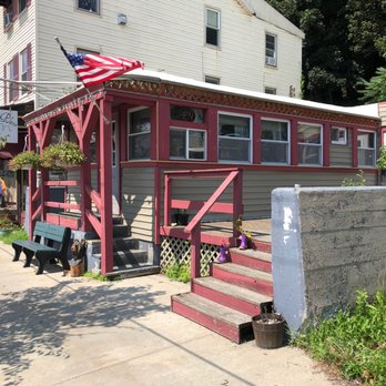 That Little Place On Main - a house with a flag on it - Diners Near Me - Little Falls, New York