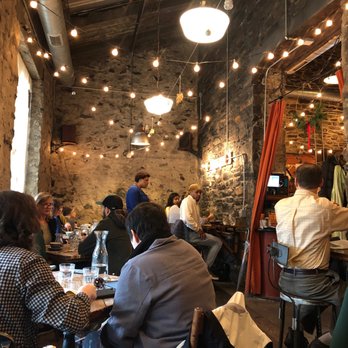 Artifact Coffee - The secondary dining room off the main room, complete with two bars along either wall. - Cafes Near Me - Baltimore, Maryland