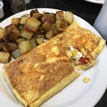 Theo's Cozy Corner - Supreme Omelet (sweet corn, cream cheese, and tomatoes) with home fries. Yum! - Breakfast & Brunch Near Me - Boston, Massachusetts Theo's Cozy Corner - Supreme Omelet (sweet corn, cream cheese, and tomatoes) with home fries. Yum! - Breakfast & Brunch Near Me - Boston, Massachusetts