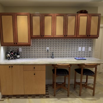 TMK Remodeling - a kitchen with wooden cabinets and marble counter tops - General Contractors Near Me - North Andover, Massachusetts TMK Remodeling - a kitchen with wooden cabinets and marble counter tops - General Contractors Near Me - North Andover, Massachusetts